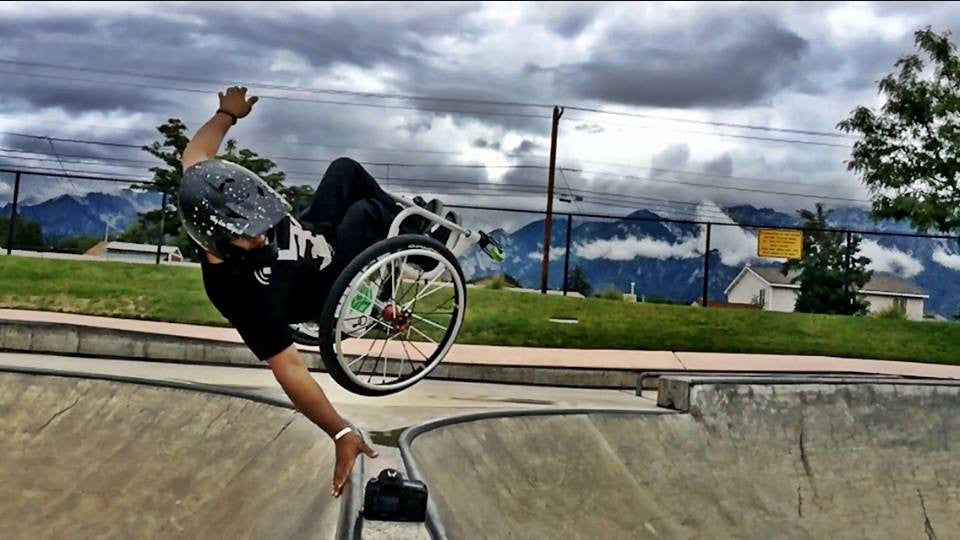 Wheelz performing a trick in his wcmx wheelchair with Frog Legs Front Forks