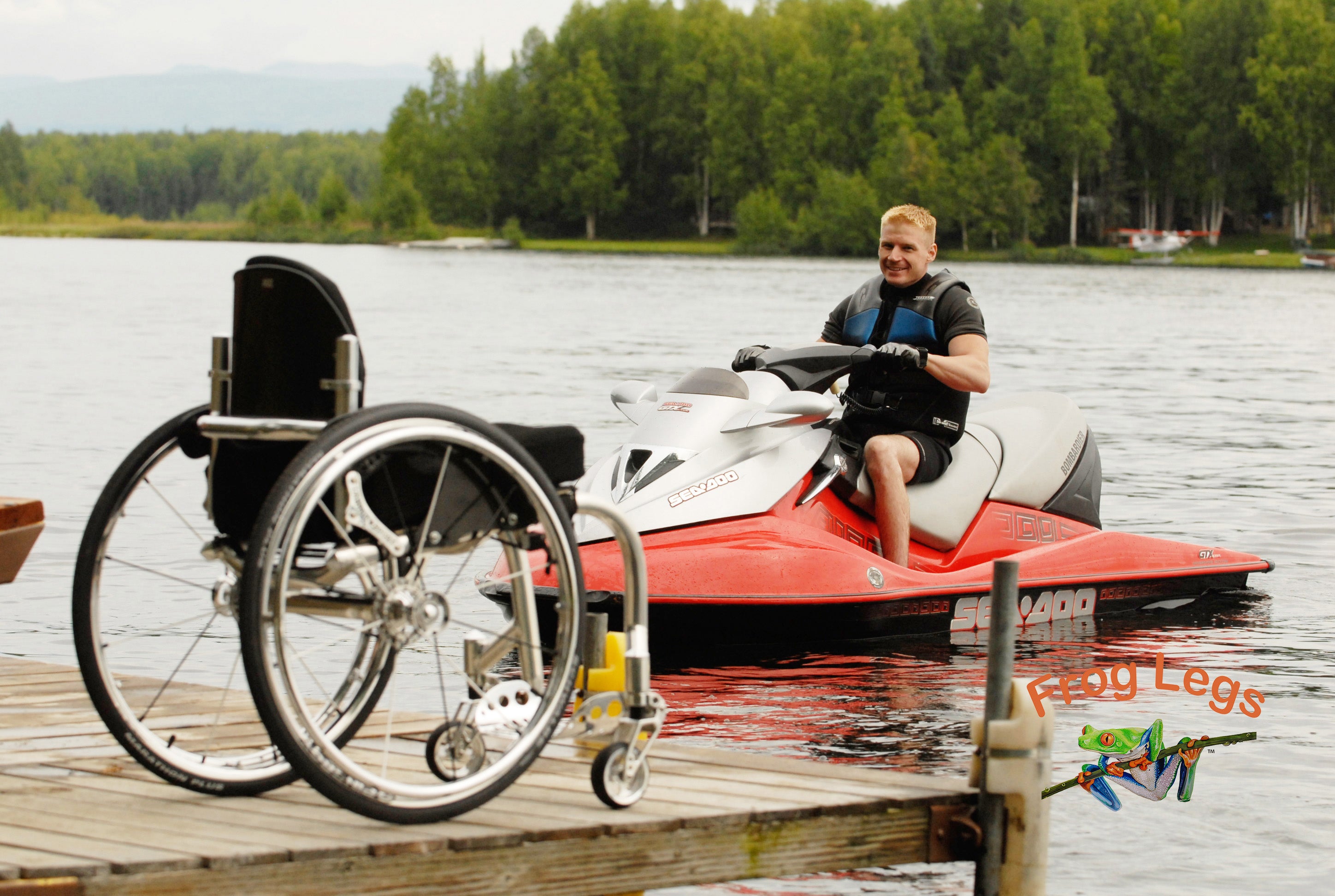 Person riding jet ski with their wheelchair on the dock